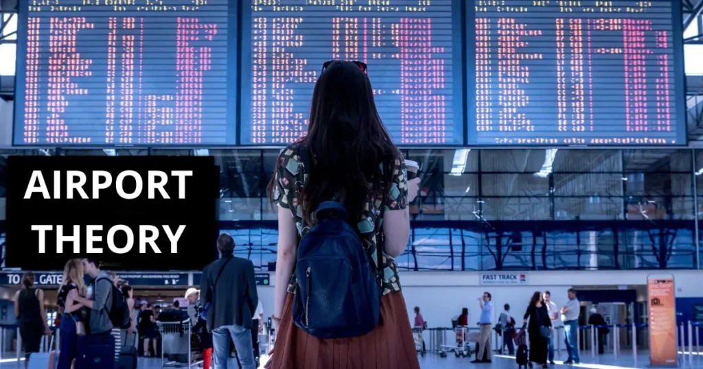 Reiziger van achteren voor het vertrekbord van een luchthaven