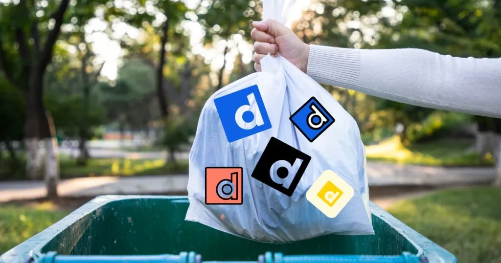 Vuilniszak vol Dailymotion-logo's die in een container wordt gegooid