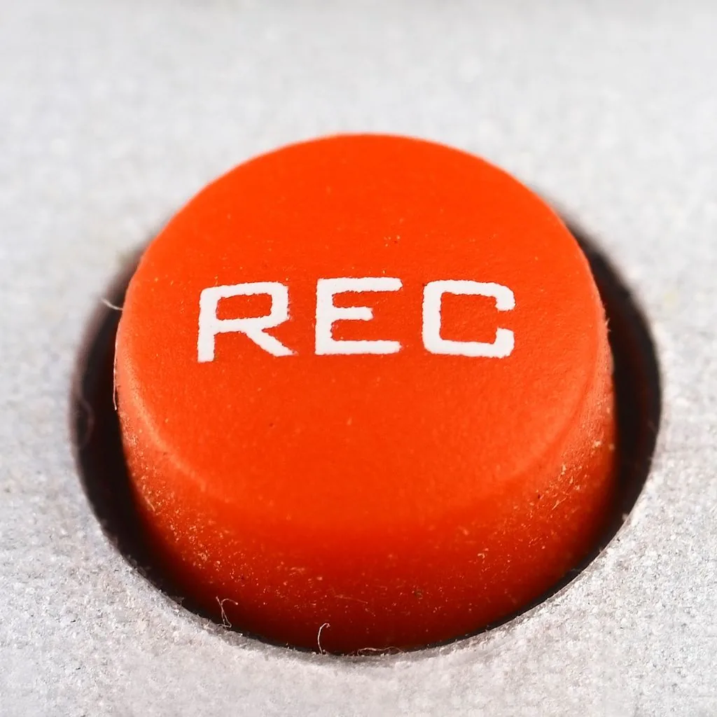 Rode opnameknop met de tekst REC