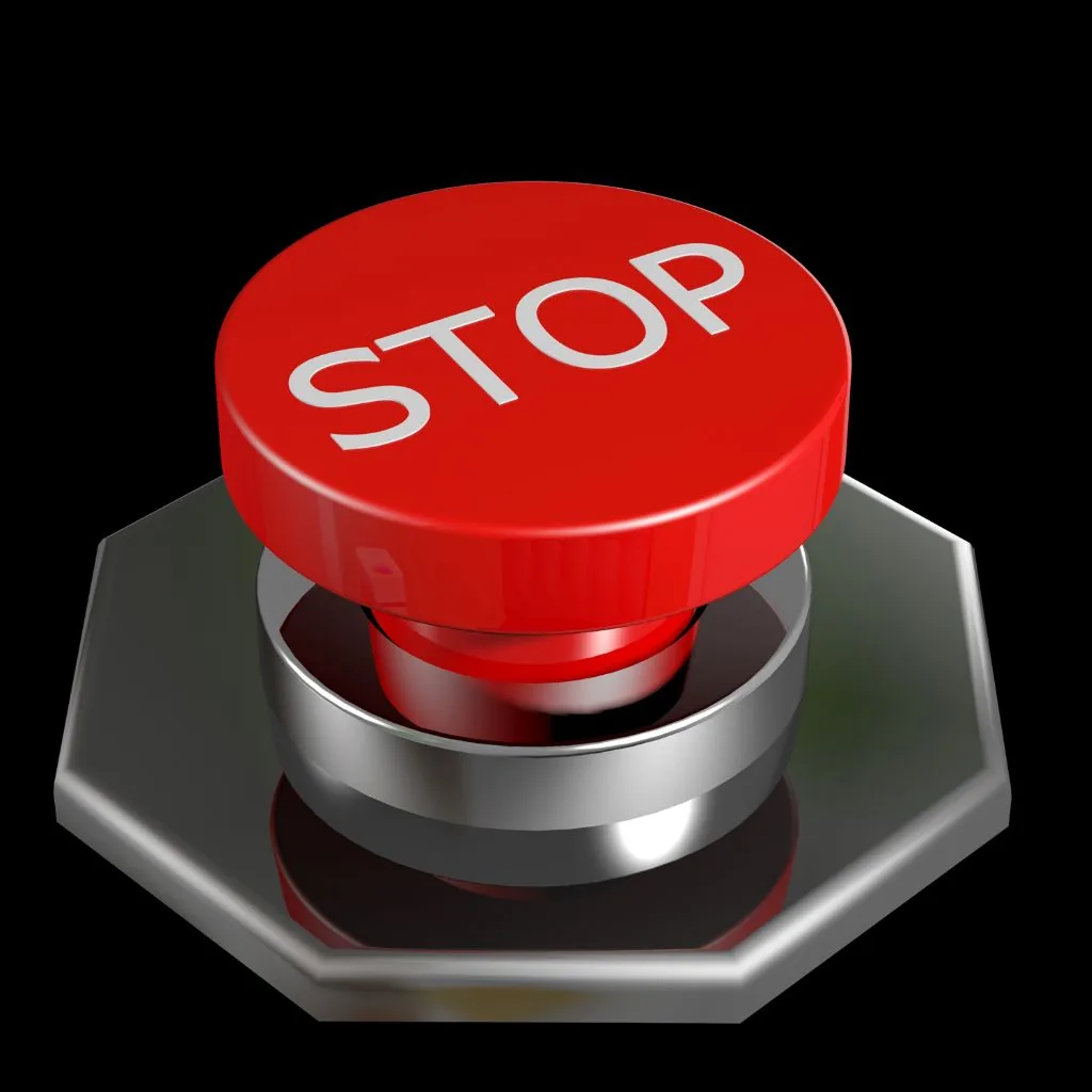 Grote rode STOP-knop op een zwarte achtergrond